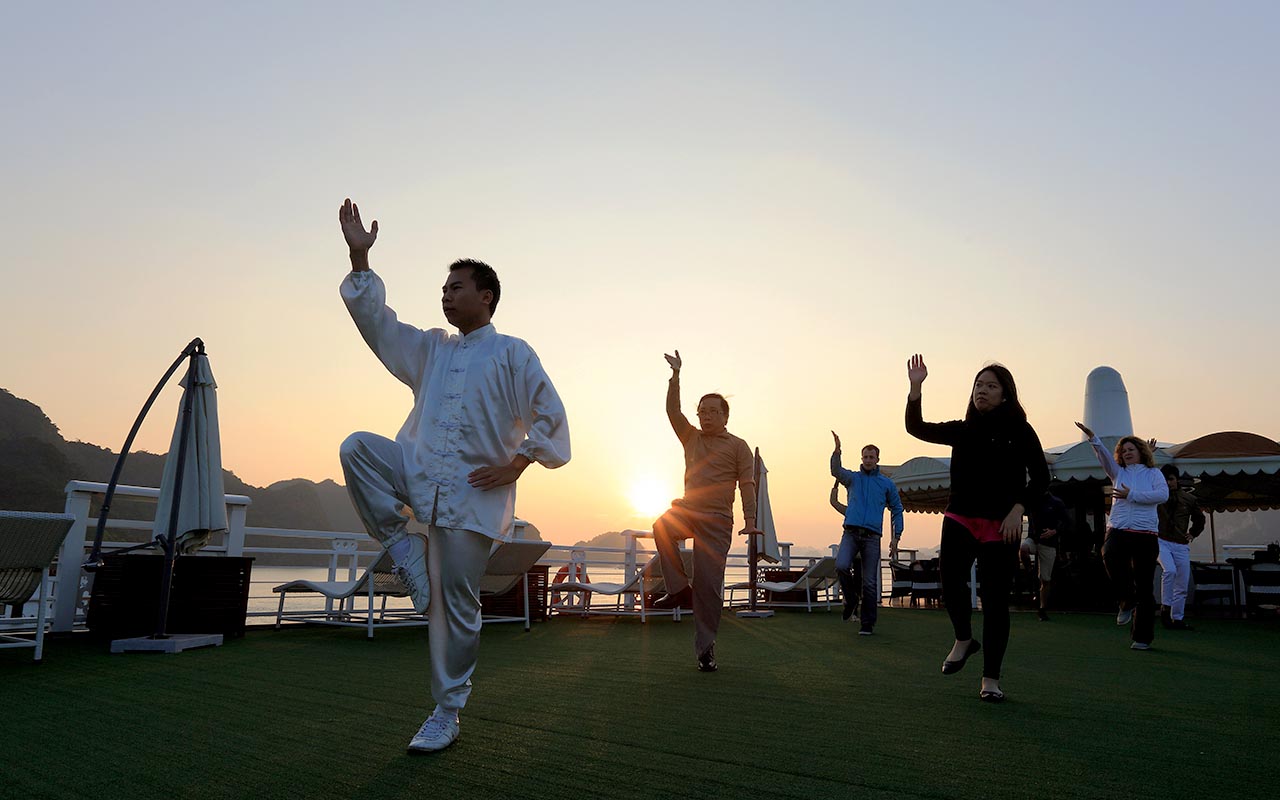 Taking Tai Chi session on the sundeck